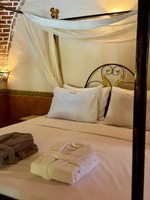 a bedroom with two beds with towels on them at El Juneina Villas in Luxor