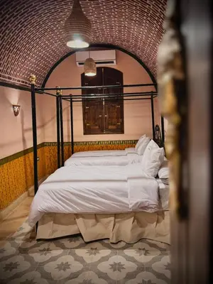 a bedroom with a large bed in a room at El Juneina Villas in Luxor