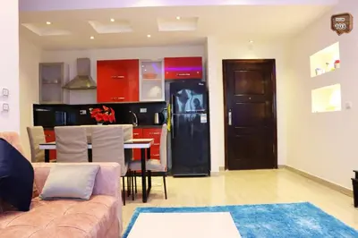 a living room with a couch and a kitchen at Touristic centre beach1 in Hurghada