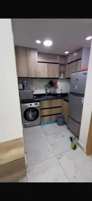 a small kitchen with a stove and a refrigerator at ميراج باى الغردقه in Hurghada