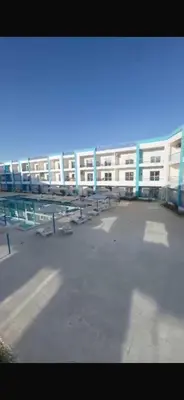 an empty parking lot in front of a building at ميراج باى الغردقه in Hurghada