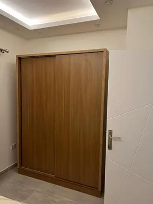 a wooden door in the corner of a room at Royal view suite in Hurghada