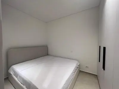 a small bedroom with a white bed in it at Cozy 1BR Retreat in Gouna in Hurghada