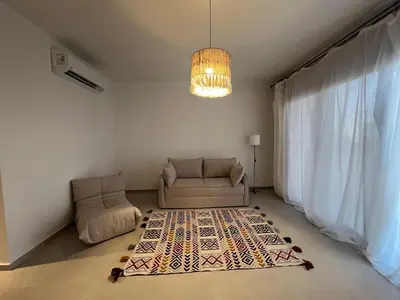 a living room with a couch and a rug at Cozy 1BR Retreat in Gouna in Hurghada