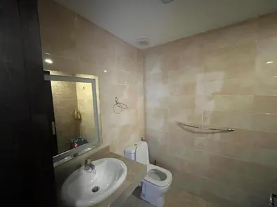 a bathroom with a sink and a toilet at شاليه ميراج باي ريزورت in Hurghada
