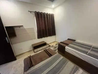 a bedroom with a bed and a window in it at شاليه ميراج باي ريزورت in Hurghada