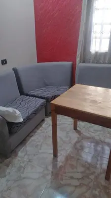 a living room with a couch and a table at The Nile apartment in Luxor