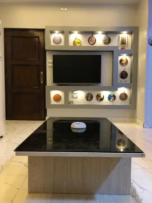 a living room with a tv and a counter top at sheraton street in Hurghada