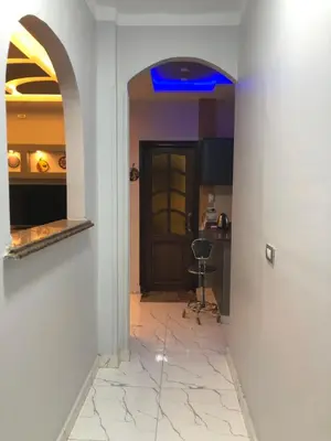 a hallway with a door and a tile floor at sheraton street in Hurghada