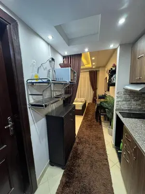a kitchen with a sink and a counter top at كمباوند فلورينزا خمسين وسط الغردقه in Hurghada
