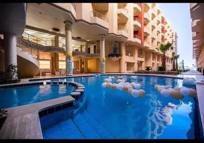 a large swimming pool in a large building at كذابلانكا بيتش in Hurghada