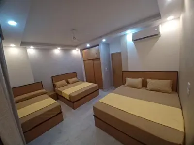 a bedroom with two beds at ميراج باي ريزورت منتجع لافستا in Hurghada