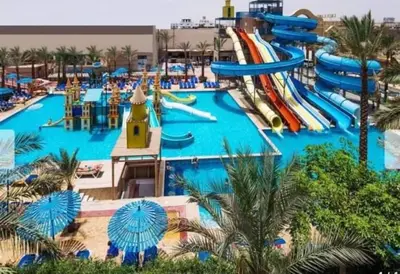 a large water park with a water slide at ميراج باي ريزورت منتجع لافستا in Hurghada