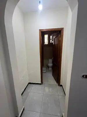 a hallway with a toilet in a room at 3 bedroom duplex in Hurghada