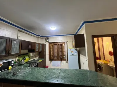 a kitchen with a green counter top in a room at 3 bedroom duplex in Hurghada