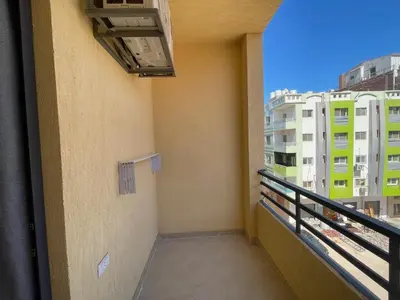 a balcony of a building with a view of buildings at Bayt Hassan A12 - 2 bedrooms European new apartment in Hurghada