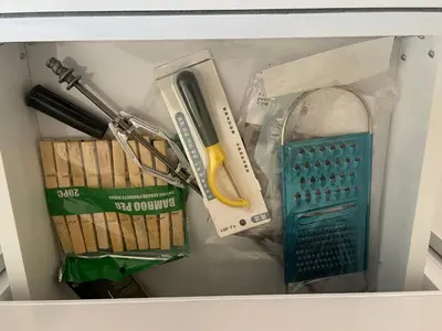 a box filled with different types of kitchen utensils at Bayt Hassan A12 - 2 bedrooms European new apartment in Hurghada