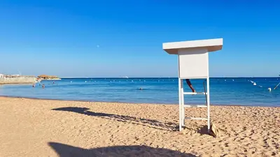 a shadow of a sign on the beach at touristic centre Andalusia in Hurghada