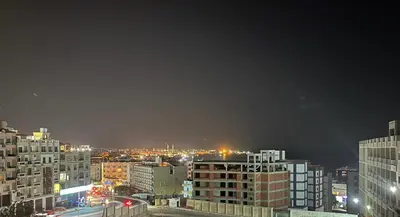 a view of a city at night with buildings at Hurghada Portrait in Hurghada