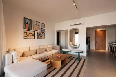 a living room with a couch and a table at Serene 1BR Haven Kamaran in Hurghada