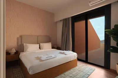 a bedroom with a bed with two towels on it at Serene 1BR Haven Kamaran in Hurghada