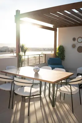 a dining room with a table and chairs at Shedwan Sky Loft Rooftop Escape with Pool View in Hurghada