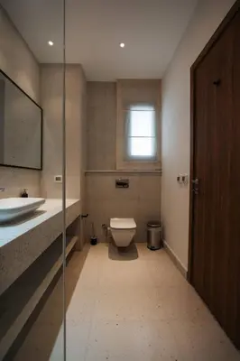 a bathroom with a toilet and a sink at Fanadir Marina Plunge Pool & Sea View in Hurghada