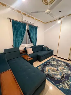 a living room with a couch and a table at Poseidon Apartments in Hurghada
