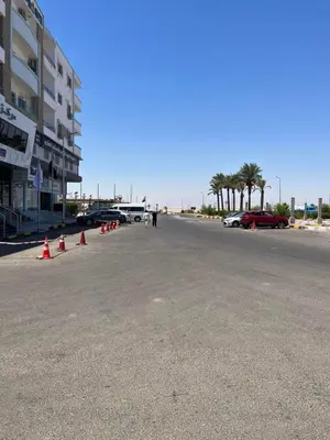 an empty parking lot with orange cones on the street at Poseidon Apartments in Hurghada