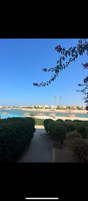 a pathway leading to a body of water at Cozy Lagoon Escpae-1Bdr Retreat in Hurghada