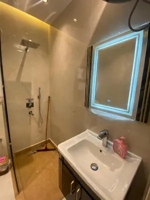 a bathroom with a sink and a shower at Private apartment in Hurghada