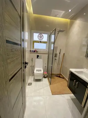 a bathroom with a toilet and a sink at Private apartment in Hurghada