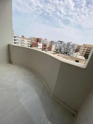 a balcony with a view of a city at Private apartment in Hurghada
