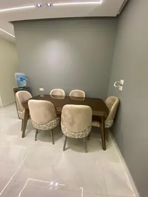 a dining room with a table and chairs at Private apartment in Hurghada