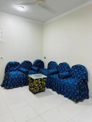 a row of blue chairs in a room at Habob Nubian Guest House in Aswan