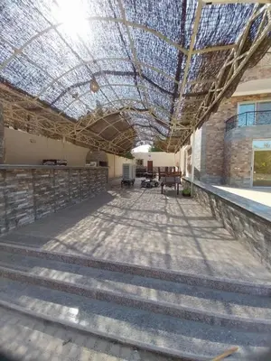 a building with a glass ceiling and stairs at فيلا مبارك الغردقه البحر الاحمر in Hurghada