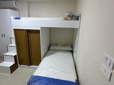 a small room with a bunk bed and a sink at Helal Apartment in Hurghada