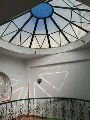 a ceiling with a glass window above a staircase at Nube's dream house in Luxor