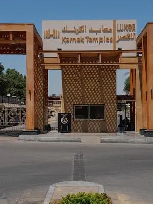 a building with a sign that reads karami temples at Nube's dream house in Luxor