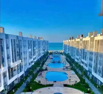 an aerial view of a resort with two swimming pools at Hurghada Fanader Bay Lever111 in Hurghada
