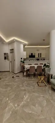 a large living room with a piano and chairs at فيلا بجوار سينزو مول in Hurghada