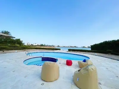 a swimming pool in the middle of a resort at Beautiful 4 BDR Villa With Private Pool in Hurghada