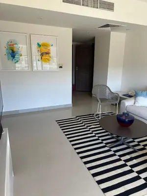a living room with a couch and a table at G cribs cozy 1bd apartment in El Gouna