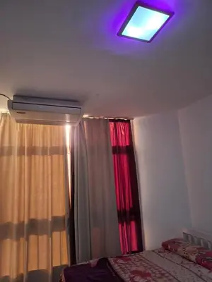 a room with a bed and a ceiling with a light at Desert pearl in Hurghada