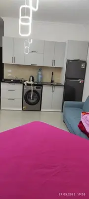 a kitchen with a sink and a pink rug at Fiesta resort in Hurghada