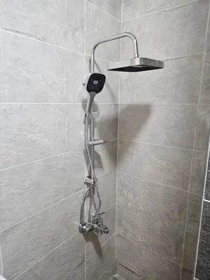 a shower with a hair dryer in a shower stall at Aqua infinity in Hurghada