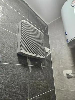 a bathroom with a air conditioner on a tile floor at Aqua infinity in Hurghada