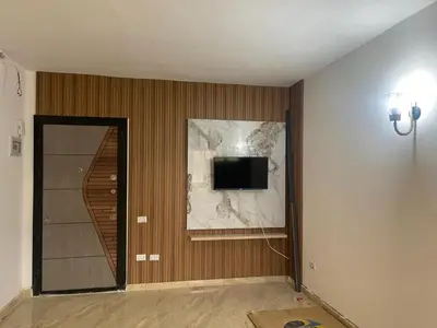 a room with a wall with a tv on a wall at شقة مبارك in Hurghada
