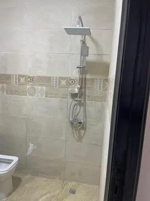 a shower in a bathroom with a toilet at شقة مبارك in Hurghada