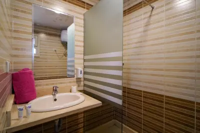 a bathroom with a sink and a mirror at Hurghada Studios in Hurghada